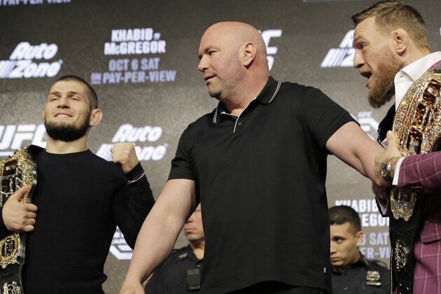 Conor McGregor, right, and Khabib Nurmagomedov, left, are separated by UFC president Dana White during a news conference in New York, Thursday, Sept. 20, 2018. McGregor is returning to UFC after a two-year absence. He fights undefeated Nurmagomedov on Oct. 6. (AP Photo/Seth Wenig)