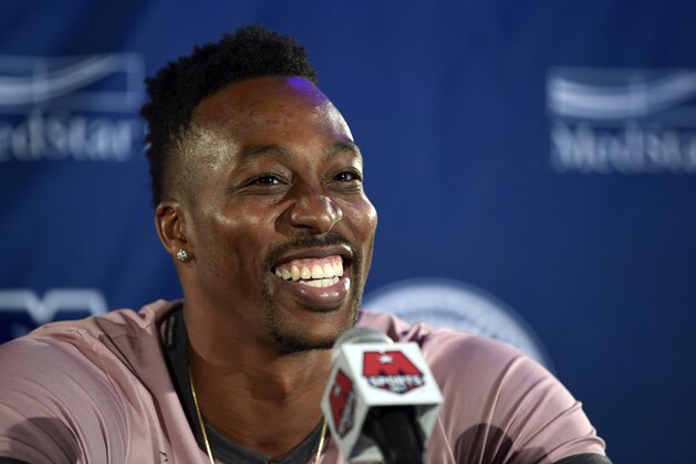 Washington Wizards recently acquired center Dwight Howard speaks during a news conference in Washington, Monday, July 23, 2018. Howard, an eight-time All-Star, averaged 16.6 points per game and 12.5 rebounds last season with the Charlotte Hornets. (AP Photo/Susan Walsh)