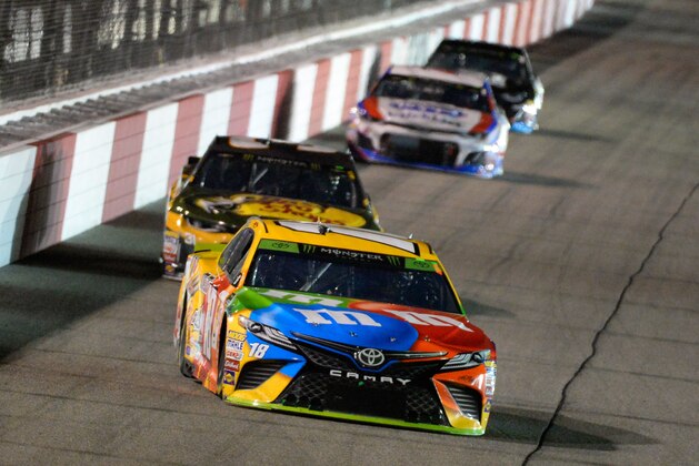 RICHMOND, VA - SEPTEMBER 22:  Kyle Busch, driver of the #18 M&M's Toyota, leads a pack of cars during the Monster Energy NASCAR Cup Series Federated Auto Parts 400 at Richmond Raceway on September 22, 2018 in Richmond, Virginia.  (Photo by Robert Laberge/Getty Images)