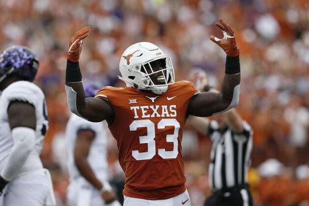 AUSTIN, TX - SEPTEMBER 22:  Gary Johnson #33 of the Texas Longhorns celebrates after a tackle in the first half against the TCU Horned Frogs at Darrell K Royal-Texas Memorial Stadium on September 22, 2018 in Austin, Texas.  (Photo by Tim Warner/Getty Images)