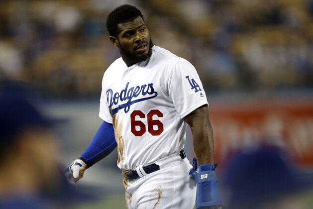 Los Angeles Dodgers' Yasiel Puig looks over after getting tagged out at third during the first inning of a baseball game aLos Angeles Dodgers in Los Angeles, Monday, Sept. 17, 2018. (AP Photo/Alex Gallardo)