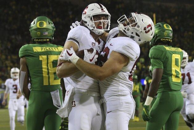 Stanford's Colby Parkinson, front left, and Kaden Smith celebrate a Stanford touchdown in overtime that put the team ahead for good against Oregon in an NCAA college football game Saturday, Sept. 22, 2018, in Eugene, Ore. Stanford won 38-31. (AP Photo/Chris Pietsch)