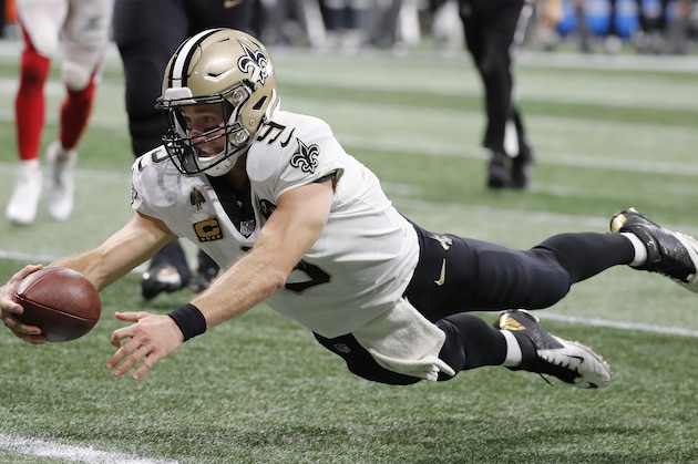New Orleans Saints quarterback Drew Brees (9) dives into the end zone for a touchdown against the Atlanta Falcons during the second half of an NFL football game, Sunday, Sept. 23, 2018, in Atlanta. (AP Photo/David Goldman)