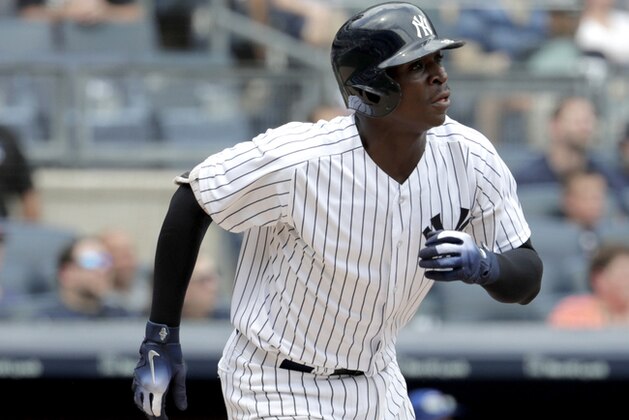 New York Yankees shortstop Didi Gregorius watches as his ball goes over the wall for a two-run home run off Toronto Blue Jays starting pitcher Sean Reid-Foley during the first inning of a baseball game, Saturday, Aug. 18, 2018, in New York. (AP Photo/Julio Cortez)