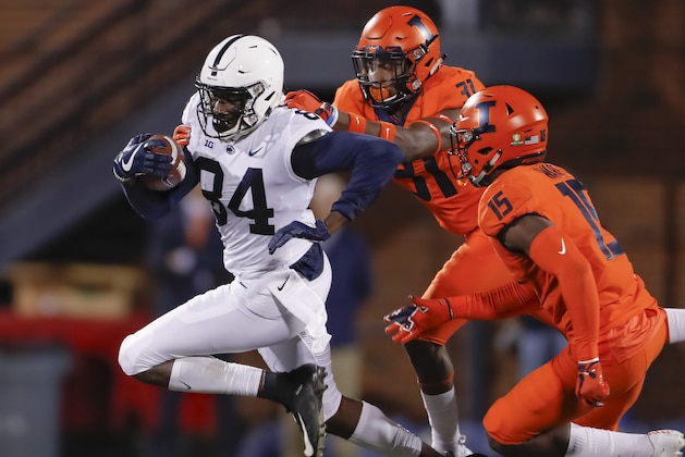 CHAMPAIGN, IL - SEPTEMBER 21: Juwan Johnson #84 of the Penn State Nittany Lions runs the ball after a catch as Cameron Watkins #31 of the Illinois Fighting Illini reaches for the tackle at Memorial Stadium on September 21, 2018 in Champaign, Illinois. (Photo by Michael Hickey/Getty Images)