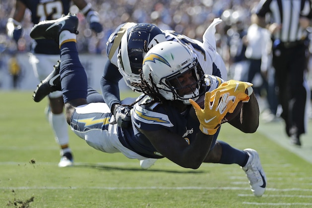 Los Angeles Chargers wide receiver Mike Williams scores in front of Los Angeles Rams defensive back Lamarcus Joyner during the second half in an NFL football game Sunday, Sept. 23, 2018, in Los Angeles. (AP Photo/Jae C. Hong)
