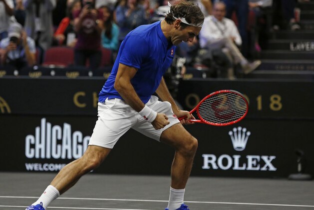 Team Europe's Roger Federer celebrates a point during a men's singles tennis match against Team World's John Isner at the Laver Cup, Sunday, Sept. 23, 2018, in Chicago. (AP Photo/Jim Young)