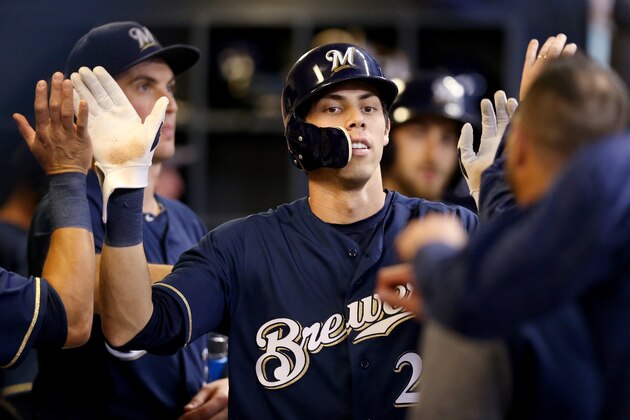MILWAUKEE, WI - SEPTEMBER 19:  Christian Yelich #22 of the Milwaukee Brewers celebrates with teammates after scoring a run in the first inning against the Cincinnati Reds at Miller Park on September 19, 2018 in Milwaukee, Wisconsin. (Photo by Dylan Buell/Getty Images)