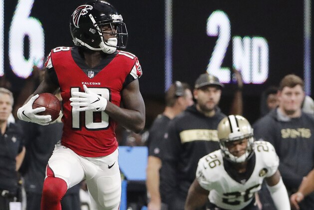 Atlanta Falcons wide receiver Calvin Ridley (18) runs into the end zone for a touchdown against New Orleans Saints cornerback P.J. Williams (26) during the first half of an NFL football game, Sunday, Sept. 23, 2018, in Atlanta. (AP Photo/David Goldman)