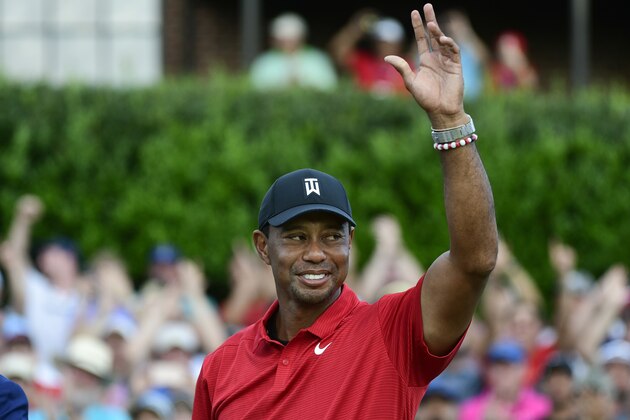 Tiger Woods celebrates on the 18th green after wining the Tour Championship golf tournament Sunday, Sept. 23, 2018, in Atlanta. (AP Photo/John Amis)