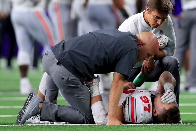 ARLINGTON, TX - SEPTEMBER 15:  Nick Bosa #97 of the Ohio State Buckeyes lays on the field after being injured in the third quarter against the TCU Horned Frogs during The AdvoCare Showdown at AT&T Stadium on September 15, 2018 in Arlington, Texas.  (Photo by Tom Pennington/Getty Images)