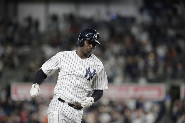 New York Yankees' Didi Gregorius celebrates as he runs the bases after hitting a home run during the first inning of a baseball game against the Baltimore Orioles Friday, Sept. 21, 2018, in New York. (AP Photo/Frank Franklin II)