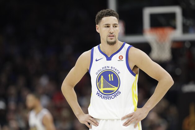 Golden State Warriors' Klay Thompson watches in the first half of Game 3 of basketball's NBA Finals against the Cleveland Cavaliers, Wednesday, June 6, 2018, in Cleveland. (AP Photo/Tony Dejak)