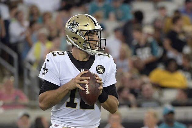 New Orleans Saints quarterback Tom Savage looks for a receiver against the Jacksonville Jaguars during the first half of an NFL preseason football game, Thursday, Aug. 9, 2018, in Jacksonville, Fla. (AP Photo/Phelan M. Ebenhack)
