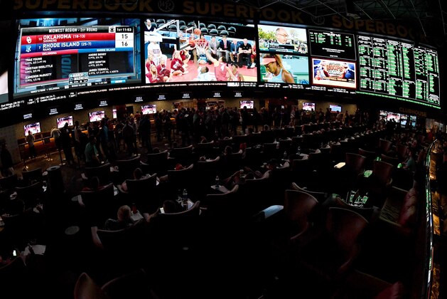 LAS VEGAS, NV - MARCH 15:  Guests attend a viewing party for the NCAA Men's College Basketball Tournament inside the 25,000-square-foot Race & Sports SuperBook at the Westgate Las Vegas Resort & Casino which features 4,488-square-feet of HD video screens on March 15, 2018 in Las Vegas, Nevada.  (Photo by Ethan Miller/Getty Images)
