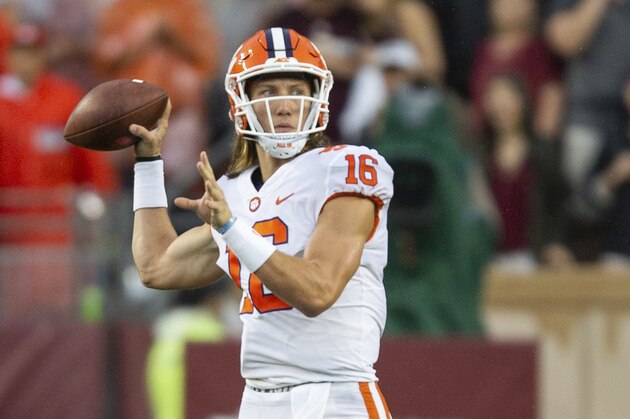 Clemson quarterback Trevor Lawrence (16) passes downfield for a touchdown against Texas A&M during the first half of an NCAA college football game Saturday, Sept. 8, 2018, in College Station, Texas. (AP Photo/Sam Craft)
