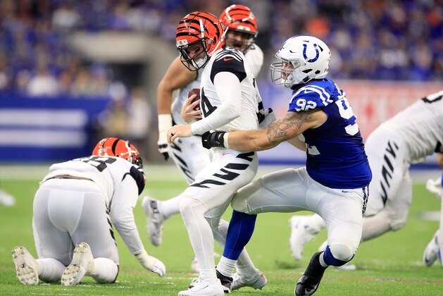 INDIANAPOLIS, IN - SEPTEMBER 09:  Andy Dalton #14 of the Cincinnati Bengals is sacked by Margus Hunt #92 of the Indianapolis Colts in the game against the Indianapolis Colts at Lucas Oil Stadium on September 9, 2018 in Indianapolis, Indiana.  (Photo by Andy Lyons/Getty Images)