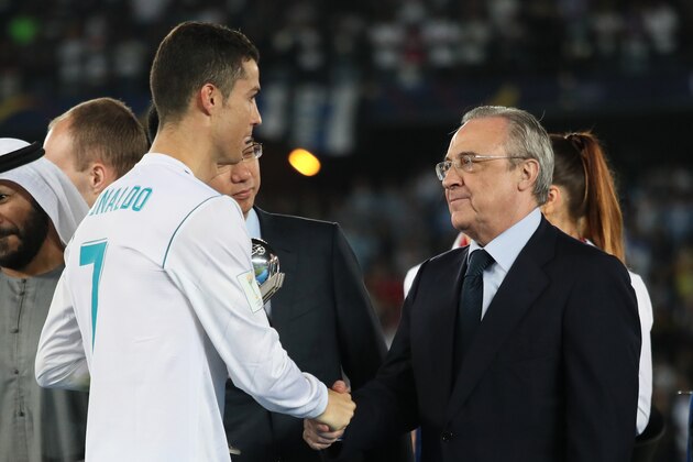 ABU DHABI, UNITED ARAB EMIRATES - DECEMBER 16:  Cristiano Ronaldo of Real Madrid shakes hands with Real Madrid President Florentino Perez at the end of the FIFA Club World Cup UAE 2017 final match between Gremio and Real Madrid CF at Zayed Sports City Stadium on December 16, 2017 in Abu Dhabi, United Arab Emirates. (Photo by Matthew Ashton - AMA/Getty Images)