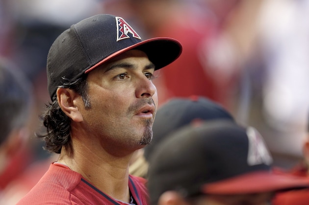 Arizona Diamondbacks' Eric Chavez pauses in the dugout prior to a spring training baseball game against the Chicago Cubs, Friday, March 28, 2014, in Phoenix.  The Cubs defeated the Diamondbacks 3-1. (AP Photo/Ross D. Franklin)