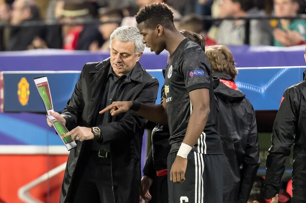 SEVILLE, SPAIN - FEBRUARY 21: Head coach Jose Mourinho of Manchester United speaks with Paul Pogba of Manchester United during the UEFA Champions League Round of 16 First Leg match between Sevilla FC and Manchester United at Estadio Ramon Sanchez Pizjuan on February 21, 2018 in Seville, Spain. (Photo by TF-Images/Getty Images)