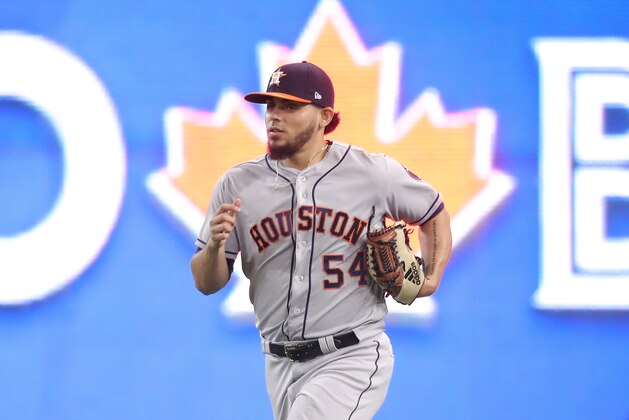 TORONTO, ON - SEPTEMBER 24: Roberto Osuna #54 of the Houston Astros comes in from the bullpen to pitch the ninth inning during MLB game action against the Toronto Blue Jays at Rogers Centre on September 24, 2018 in Toronto, Canada. (Photo by Tom Szczerbowski/Getty Images)