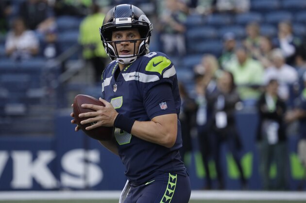 Seattle Seahawks backup quarterback Austin Davis passes during warmups before an NFL football preseason game against the Oakland Raiders, Thursday, Aug. 30, 2018, in Seattle. (AP Photo/Elaine Thompson)