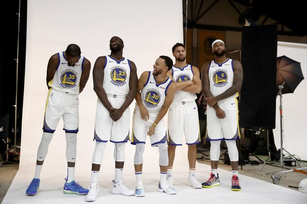 OAKLAND, CA - SEPTEMBER 24:  (L-R) Kevin Durant #35, Draymond Green #23, Stephen Curry #30, Klay Thompson #11, and DeMarcus Cousins #0 of the Golden State Warriors pose for a group picture during the Golden State Warriors media day on September 24, 2018 in Oakland, California.  (Photo by Ezra Shaw/Getty Images)