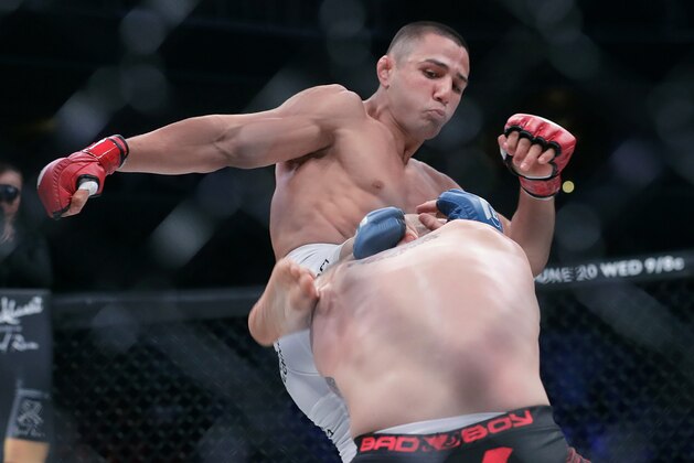 Aaron Pico, top, kicks Lee Morrison in a featherweight mixed martial arts fight at Bellator 199 in San Jose, Calif., Saturday, May 12, 2018. Pico won the fight. (AP Photo/Jeff Chiu)