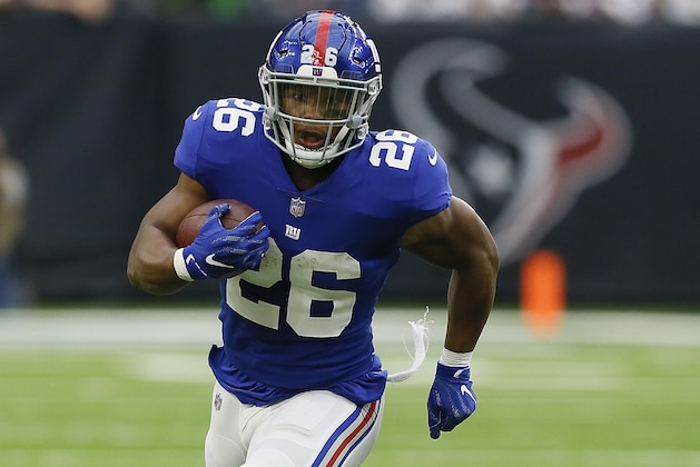 HOUSTON, TX - SEPTEMBER 23:  Saquon Barkley #26 of the New York Giants rushes with the ball against the Houston Texans at NRG Stadium on September 23, 2018 in Houston, Texas. (Photo by Bob Levey/Getty Images)