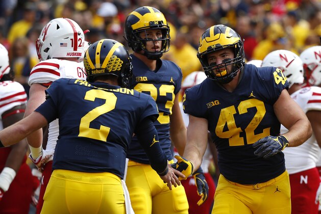 Michigan fullback Ben Mason (42) celebrates his one-yard touchdown run with Shea Patterson (2) in the first half of an NCAA football game against Nebraska in Ann Arbor, Mich., Saturday, Sept. 22, 2018. (AP Photo/Paul Sancya)