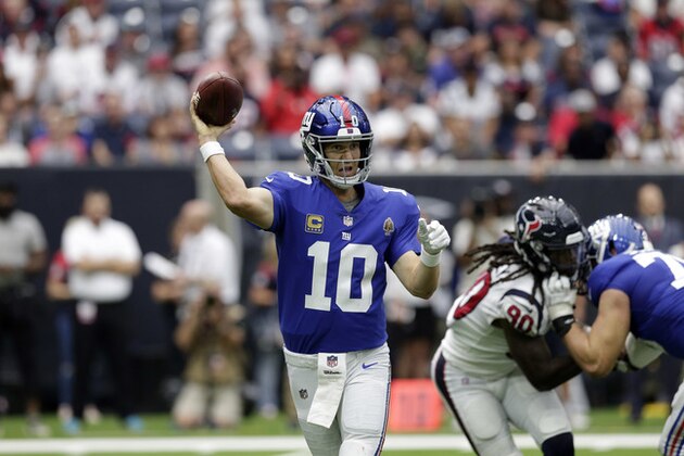 New York Giants quarterback Eli Manning (10) throws a pass against the Houston Texans during the second half of an NFL football game Sunday, Sept. 23, 2018, in Houston. (AP Photo/Michael Wyke)