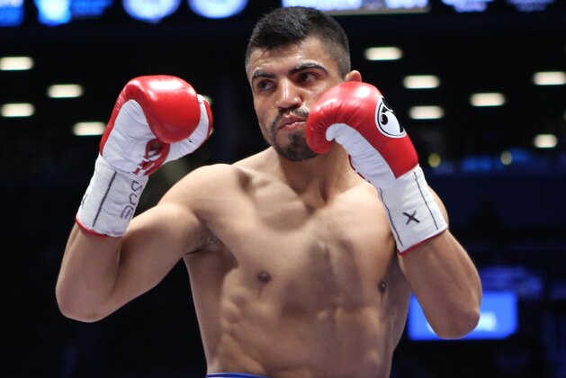 FILE - In this Jan. 30, 2014, file photo, Victor Ortiz faces Luis Collazo, not seen, in a welterweight boxing bout in the Brooklyn borough of New York. Former welterweight champion Ortiz has been charged with raping a woman inside a home in March. Police in Oxnard say the 31-year-old Ortiz turned himself in to Ventura County Sheriffs on Tuesday afternoon, Sept. 25, 2018. Police say the district attorney filed charges after a months-long investigation, and Ortiz surrendered after a warrant was issued for his arrest. (AP Photo/Julia Weeks, File)
