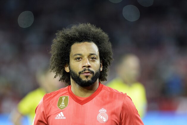 Real Madrid's Brazilian defender Marcelo (C) looks on before the Spanish league football match Sevilla FC against Real Madrid CF at the Ramon Sanchez Pizjuan stadium in Seville on September 26, 2018. (Photo by CRISTINA QUICLER / AFP)        (Photo credit should read CRISTINA QUICLER/AFP/Getty Images)
