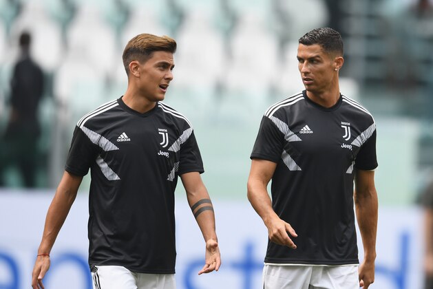 TURIN, ITALY - SEPTEMBER 16:  Cristiano Ronaldo (R) and  Paulo Dybala of Juventus chat during warm up before the serie A match between Juventus and US Sassuolo at Allianz Stadium on September 16, 2018 in Turin, Italy.  (Photo by Claudio Villa./Getty Images)