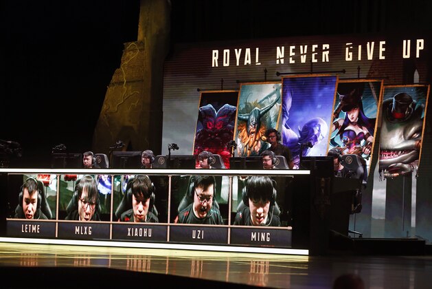 PARIS, FRANCE - MAY 18:  The Royal Never Give Up's team competes the video game 'League of Legends' during the 'Mid Season Invitational League of Legends'at the Zenith on May 18, 2018 in Paris, France. eSports also known as electronic sports, esports, e-sports are a form of competition using video games. Most commonly, eSports take the form of organized, multiplayer video games competitions, particularly between professional players. League of Legends is a famous free online battle type video game developed and published by Riot Games.  (Photo by Chesnot/Getty Images)