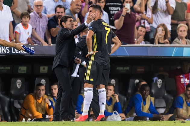(L-R) coach Marcelino García Toral of Valencia CF, Cristiano Ronaldo dos Santos Aveiro of Juventus FC during the UEFA Champions League group H match between Valencia FC and Juventus FC at Estadi de Mestalla on September 19, 2018 in Valencia, Spain(Photo by VI Images via Getty Images)