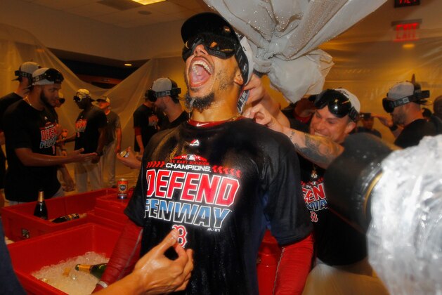 NEW YORK, NY - SEPTEMBER 20:  Mookie Betts #50 of the Boston Red Sox celebrates in the locker room after defeating the New York Yankees to clinch the American League East Division at Yankee Stadium on September 20, 2018 in the Bronx borough of New York City.  (Photo by Jim McIsaac/Getty Images)