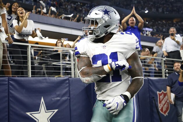 Dallas Cowboys running back Ezekiel Elliott (21) celebrates after scoring a touchdown against the New York Giants during the second half of an NFL football game in Arlington, Texas, Sunday, Sept. 16, 2018. (AP Photo/Ron Jenkins)