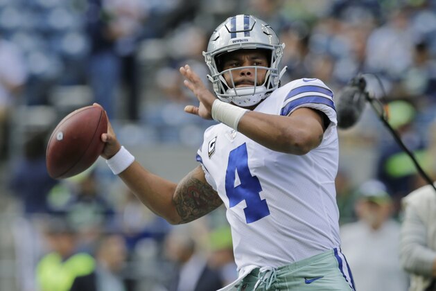 Dallas Cowboys quarterback Dak Prescott passes during warmups before an NFL football game against the Seattle Seahawks, Sunday, Sept. 23, 2018, in Seattle. (AP Photo/John Froschauer)