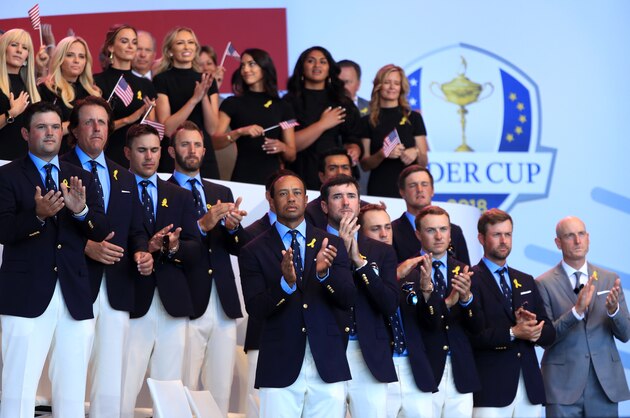 PARIS, FRANCE - SEPTEMBER 27:  Members of the united states team (Back L-R) Patrick Reed, Phil Mickelson, Brooks Koepka, Dustin Johnson, Rickie Fowler, Tony Finau, Bryson DeChambeau, (Front L-R) Tiger Woods, Bubba Watson, Justin Thomas, Jordan Spieth, Webb Simpson and Captain Jim Furyk attend the opening ceremony for the 2018 Ryder Cup at Le Golf National on September 27, 2018 in Paris, France.  (Photo by Andrew Redington/Getty Images)