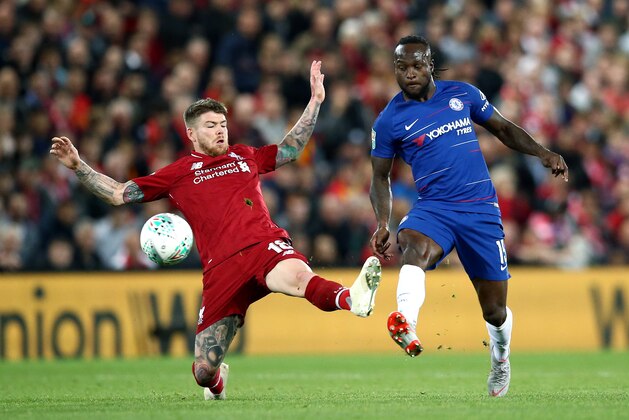 LIVERPOOL, ENGLAND - SEPTEMBER 26: Victor Moses of Chelsea is challenged by Alberto Moreno of Liverpool during the Carabao Cup Third Round match between Liverpool and Chelsea at Anfield on September 26, 2018 in Liverpool, England.  (Photo by Jan Kruger/Getty Images)