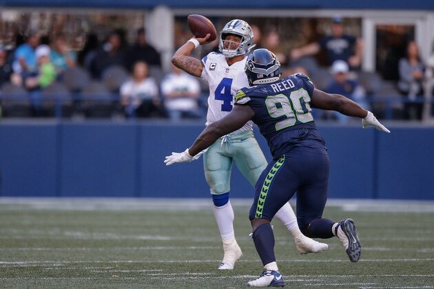 SEATTLE, WA - SEPTEMBER 23:  Quarterback Dak Prescott #4 of the Dallas Cowboys passes against defensive tackle Jarran Reed #90 of the Seattle Seahawks at CenturyLink Field on September 23, 2018 in Seattle, Washington.  (Photo by Otto Greule Jr/Getty Images)