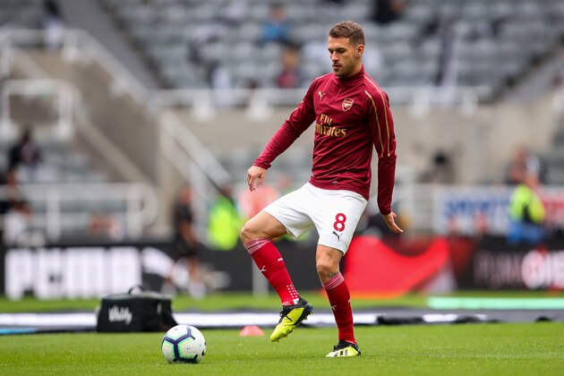 NEWCASTLE UPON TYNE, ENGLAND - SEPTEMBER 15: Aaron Ramsey of Arsenal warms up prior to the Premier League match between Newcastle United and Arsenal FC at St. James Park on September 15, 2018 in Newcastle upon Tyne, United Kingdom. (Photo by Robbie Jay Barratt - AMA/Getty Images)