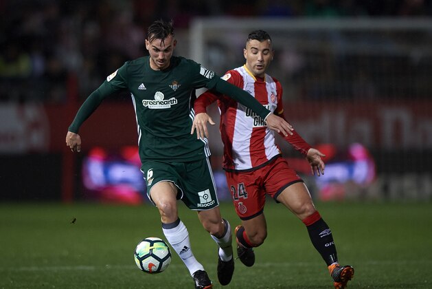 GIRONA, SPAIN - APRIL 13:  Borja Garcia (R) of Girona competes for the ball with Fabian Ruiz Pena of Real Betis during the La Liga match between Girona and Real Betis at Estadi Montilivi on April 13, 2018 in Girona, Spain.  (Photo by Quality Sport Images/Getty Images)