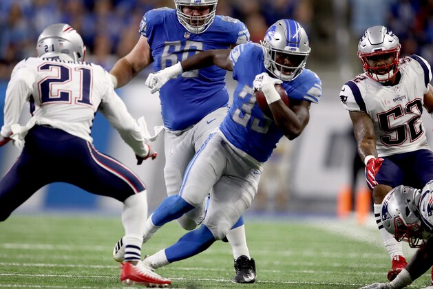 DETROIT, MI - SEPTEMBER 23:  Running back Kerryon Johnson #33 of the Detroit Lions runs for yardage against Duron Harmon #21 of the New England Patriots during the second half at Ford Field on September 23, 2018 in Detroit, Michigan. (Photo by Gregory Shamus/Getty Images)