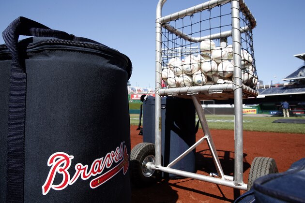 Atlanta Braves baseballs are ready before a baseball game against the Washington Nationals at Nationals Park, Wednesday, April 13, 2016, in Washington. Braves outfielder Hector Olivera was placed on paid administrative leave by Major League Baseball after he was arrested when a woman accused him of assault at a hotel outside Washington. (AP Photo/Alex Brandon)