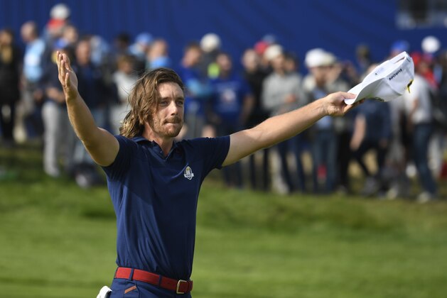 Europe's English golfer Tommy Fleetwood celebrates his victory with Europe's Italian golfer Francesco Molinari in their fourball match on the first day of the 42nd Ryder Cup at Le Golf National Course at Saint-Quentin-en-Yvelines, south-west of Paris on September 28, 2018. (Photo by Eric FEFERBERG / AFP)        (Photo credit should read ERIC FEFERBERG/AFP/Getty Images)
