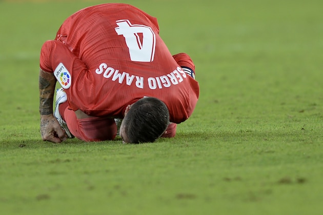 Real Madrid's Spanish defender Sergio Ramos bends on the ground during the Spanish league football match Sevilla FC against Real Madrid CF at the Ramon Sanchez Pizjuan stadium in Seville on September 26, 2018. (Photo by CRISTINA QUICLER / AFP)        (Photo credit should read CRISTINA QUICLER/AFP/Getty Images)