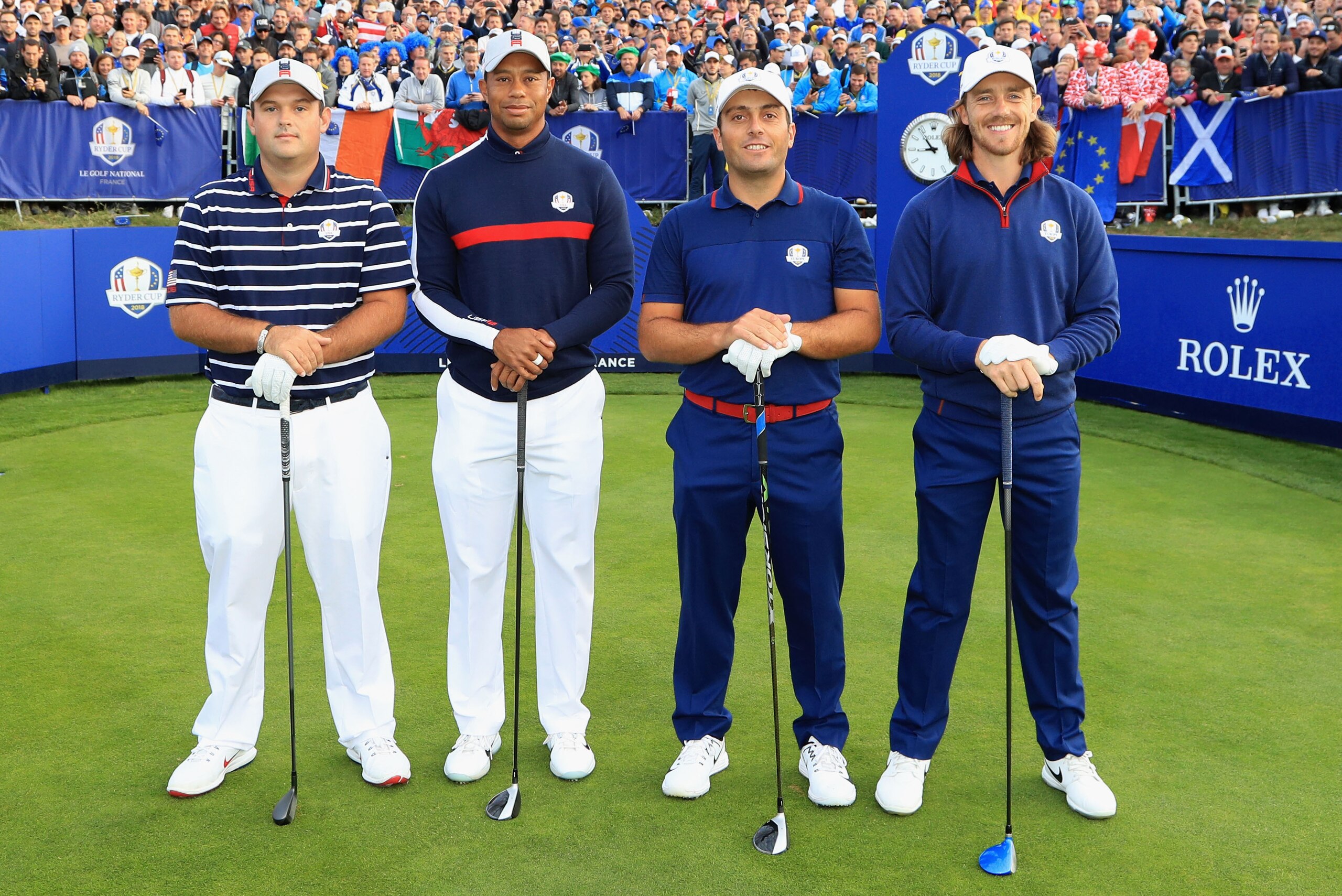 PARIS, FRANCE - SEPTEMBER 28: Patrick Reed of the United States and Tiger Woods of the United States stand next to opponants Francesco Molinari of Europe and Tommy Fleetwood of Europe on the first tee during the morning fourball matches of the 2018 Ryder Cup at Le Golf National on September 28, 2018 in Paris, France.  (Photo by Andrew Redington/Getty Images)