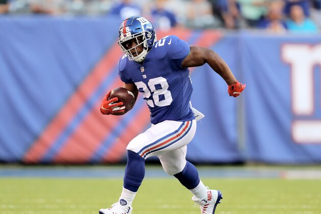 EAST RUTHERFORD, NJ - AUGUST 09:  Jonathan Stewart #28 of the New York Giants carries the ball in the first half against the Cleveland Browns during their preseason game on August 9,2018 at MetLife Stadium in East Rutherford, New Jersey.  (Photo by Elsa/Getty Images)